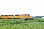 Janesville local Geeps front a loaded grain train just departing Landmark